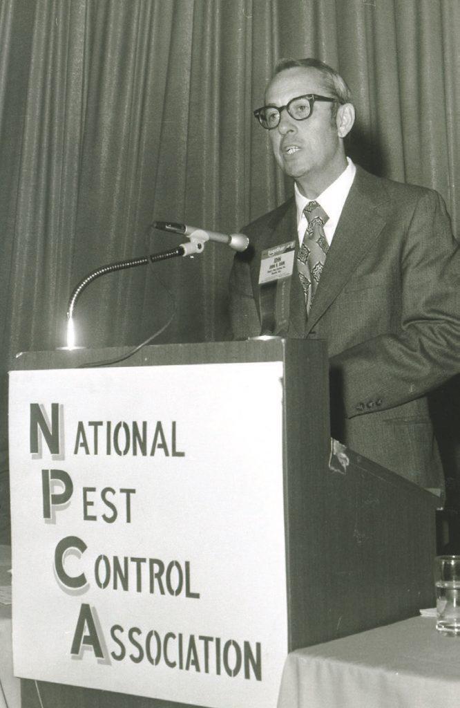 vintage photo of Mr. Cooks speaking at the National Pest Control Association